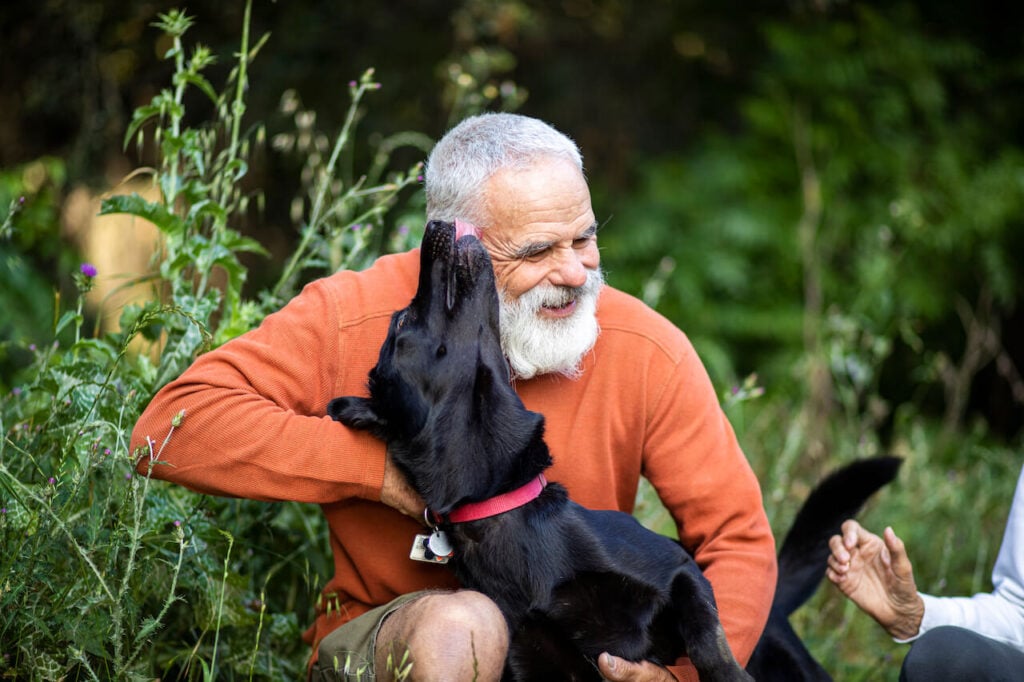man playing with his dog low-stress jobs after retirement