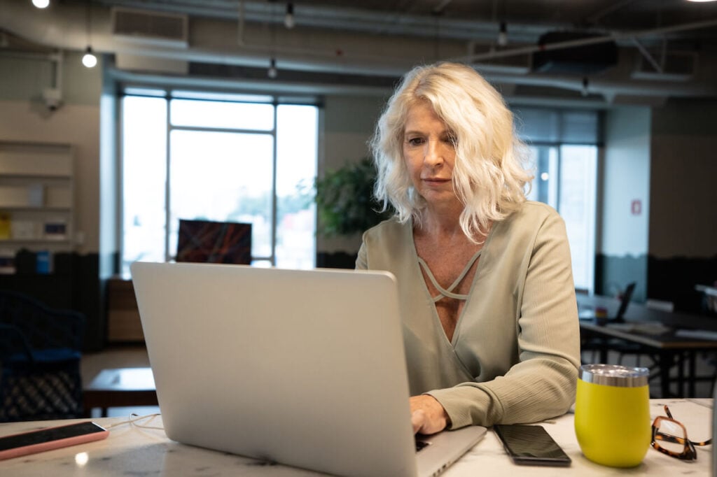 woman typing low-stress jobs after retirement