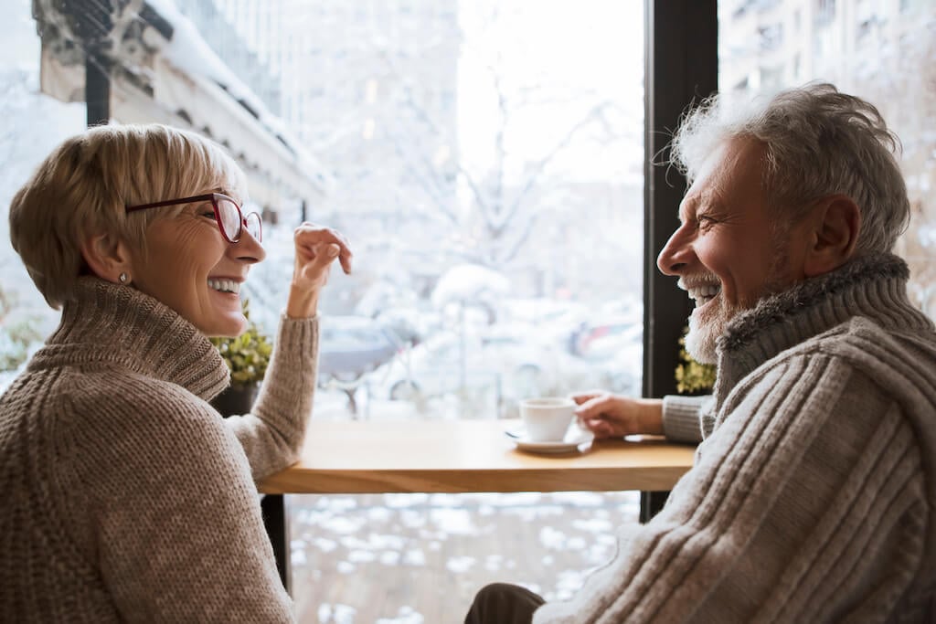 senior couple on a coffee date ways to tell if a man over 50 likes you 