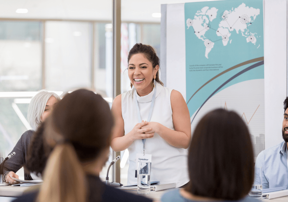 woman laughing in office retirement speech ideas