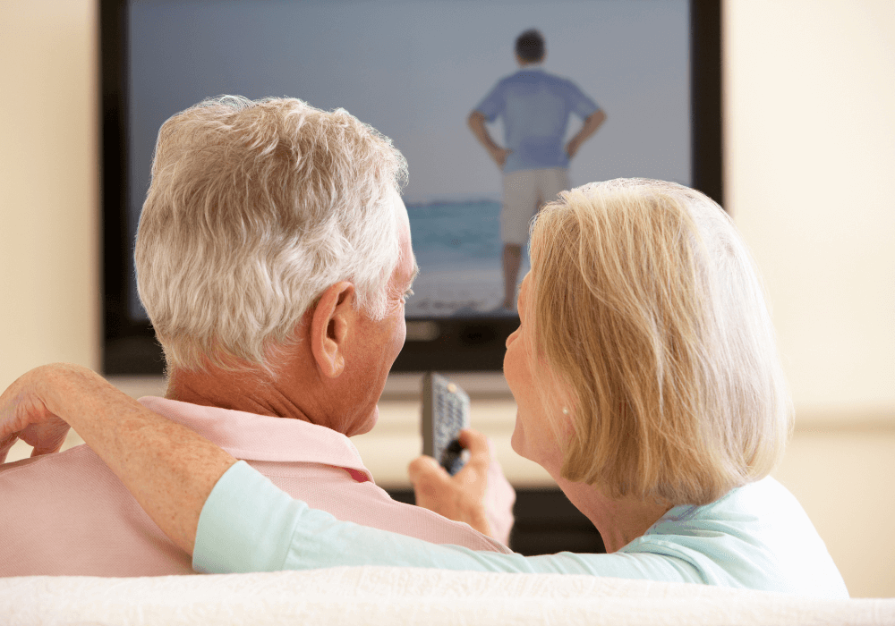 senior couple enjoying a tv show together best movies for seniors