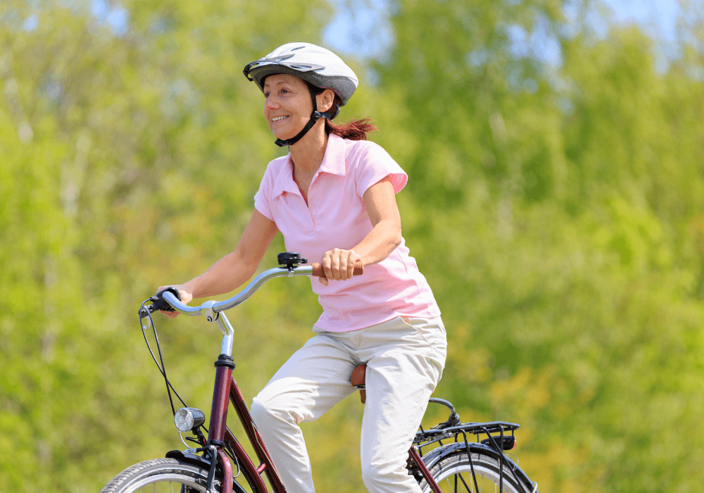 woman biking during the day how to reinvent yourself at 50