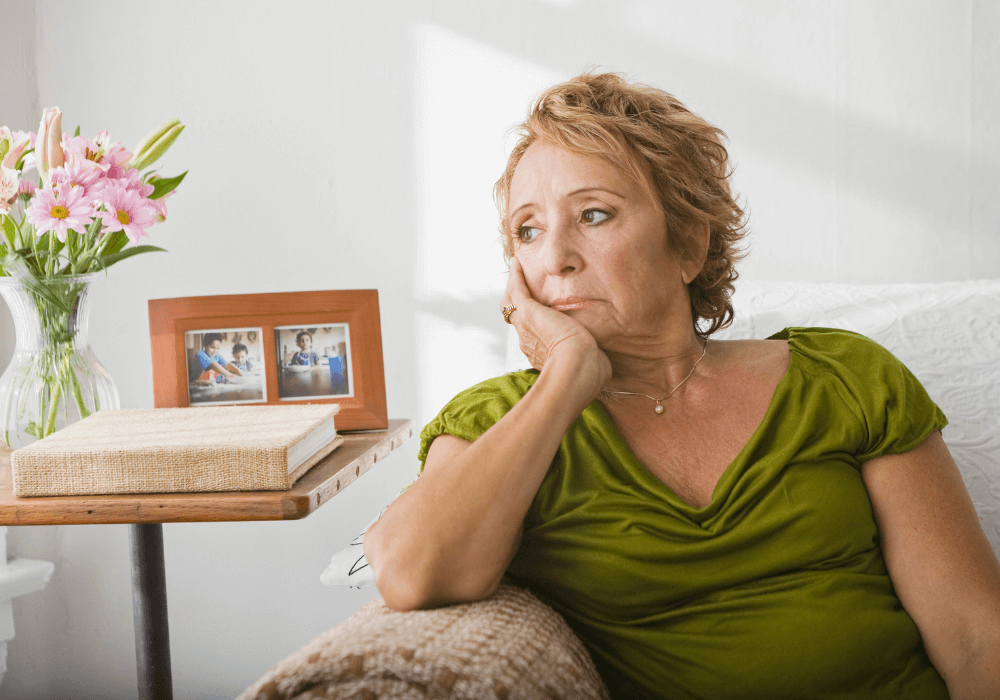 older woman sitting on sofa Grown Children Ignore Their Parents