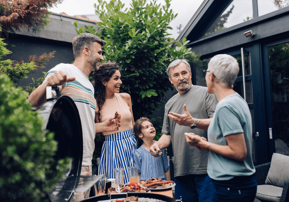 group of people having outdoor cookout Nice Things Every Parent Needs To Say To Their Grown Son