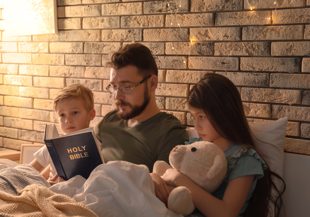 Cozy bedroom, man reading Bible to kids, bed center frame, warm string lights evening, documentary style, three people.